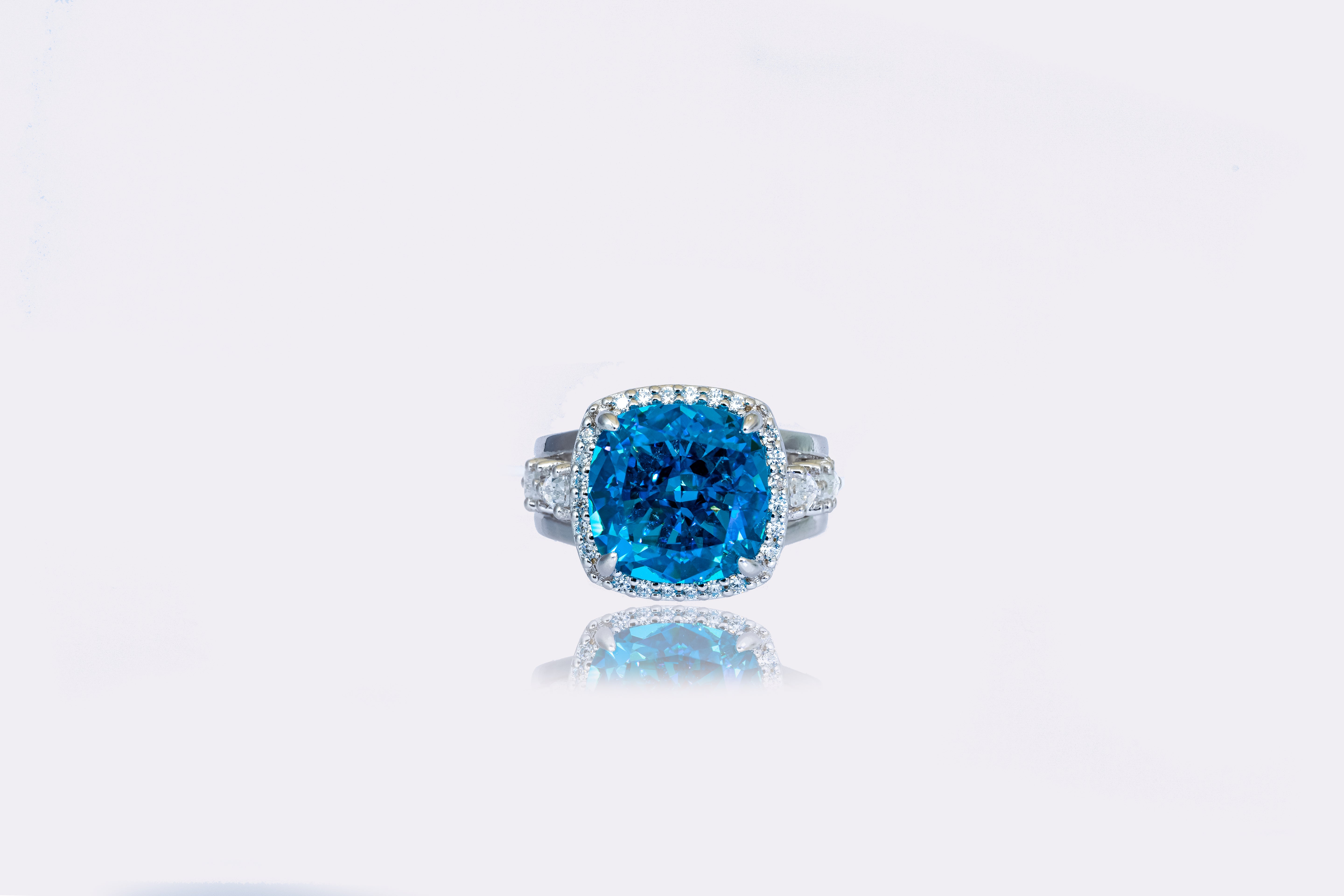 Deep Ocean Blue Diamond Halo Ring